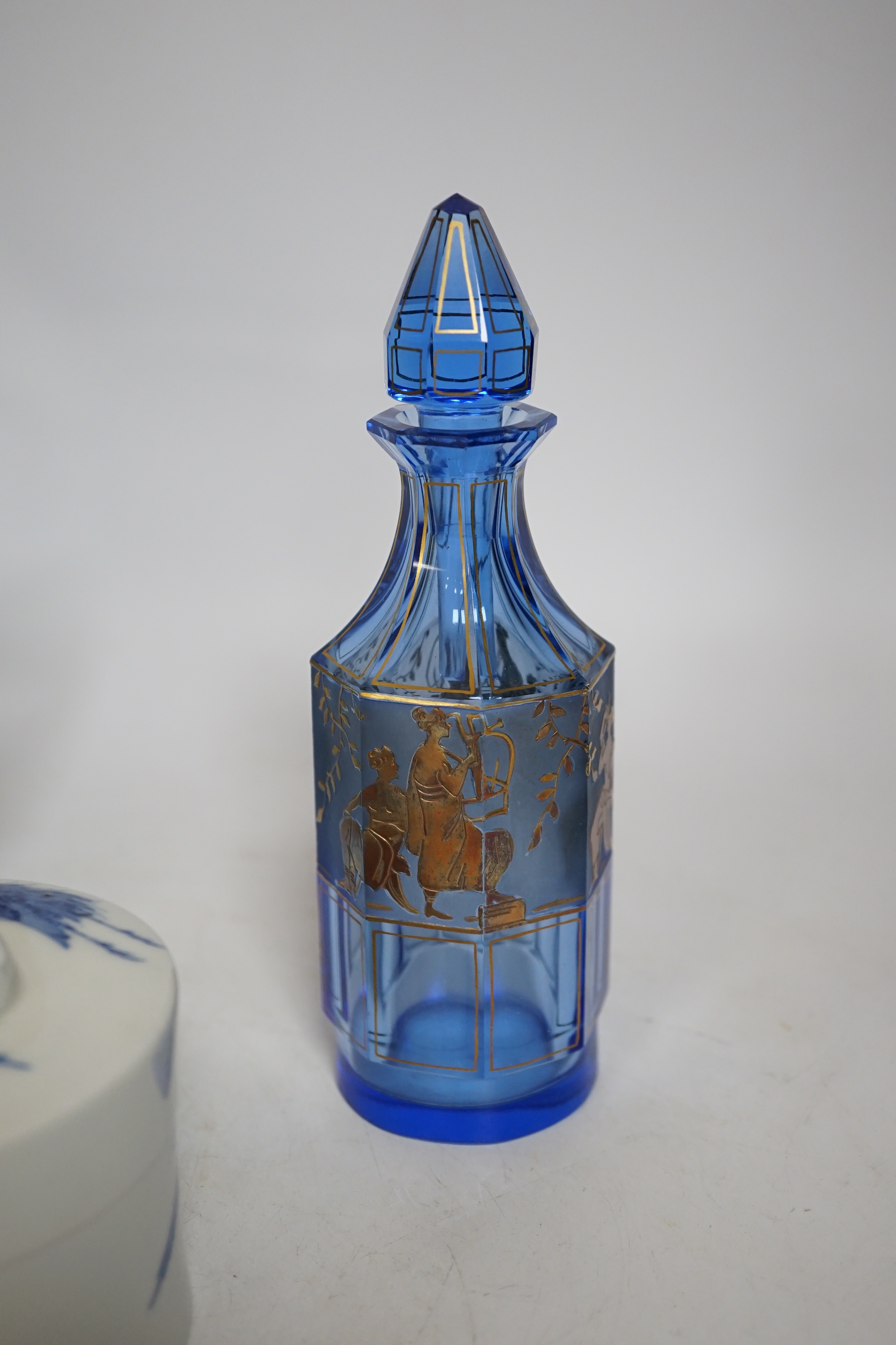 A 19th century Japanese Hirado blue and white cylindrical box and cover, height 8cms, a gold classically decorated glass bottle and a frosted glass jug and wooden pot (4)